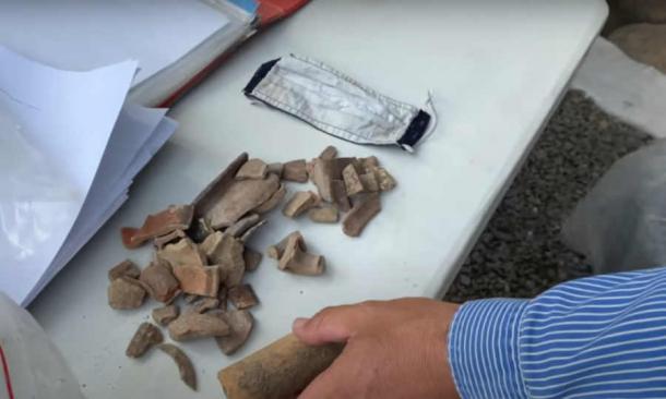 Pottery shards found underneath the rocks at the temple at Chorazin. (YouTube Screenshot/Sergio & Rhonda in Israel)